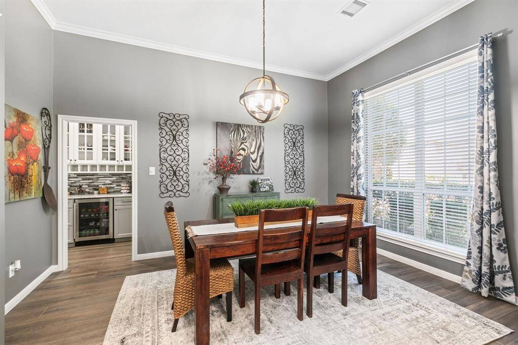 This dining room works well for formal entertaining or make it casual! It can accommodate a large crowd and large scale furniture.