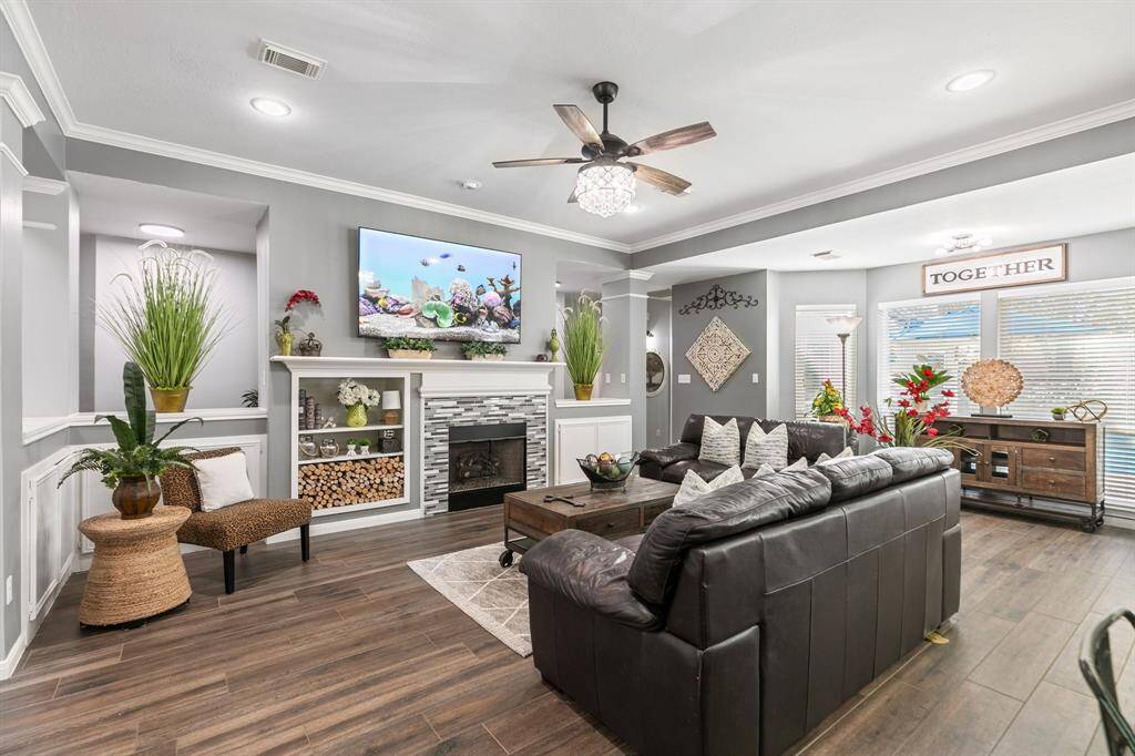 A well dressed gas firelog fireplace adds character. Wall of windows overlooking the pool.