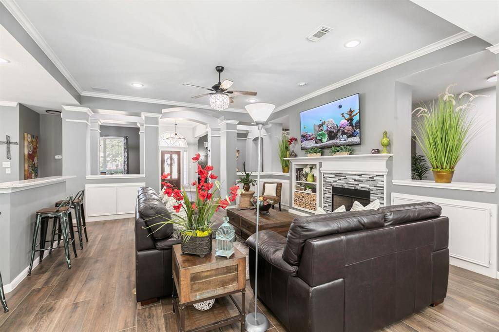 The family room is open to the kitchen and offers a comfortable space for family and friends.