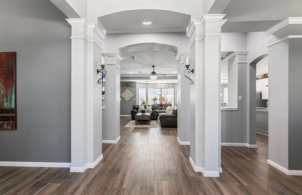 As you walk through the front door, you'll notice the many details and warm paint pallet throughout. The columns are impressive.