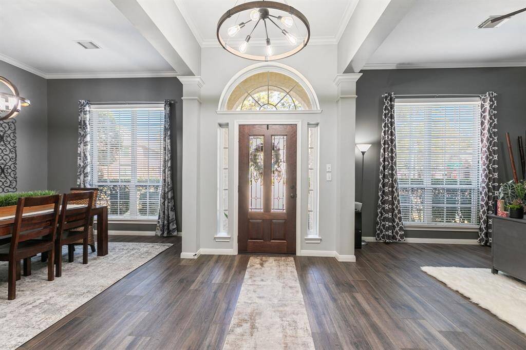 Guest will be greeted in a breathtaking one story foyer that is accented with extensive wood look tile floors, and rising ceilings.