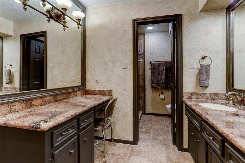 Primary bathroom with separate makeup vanity area
