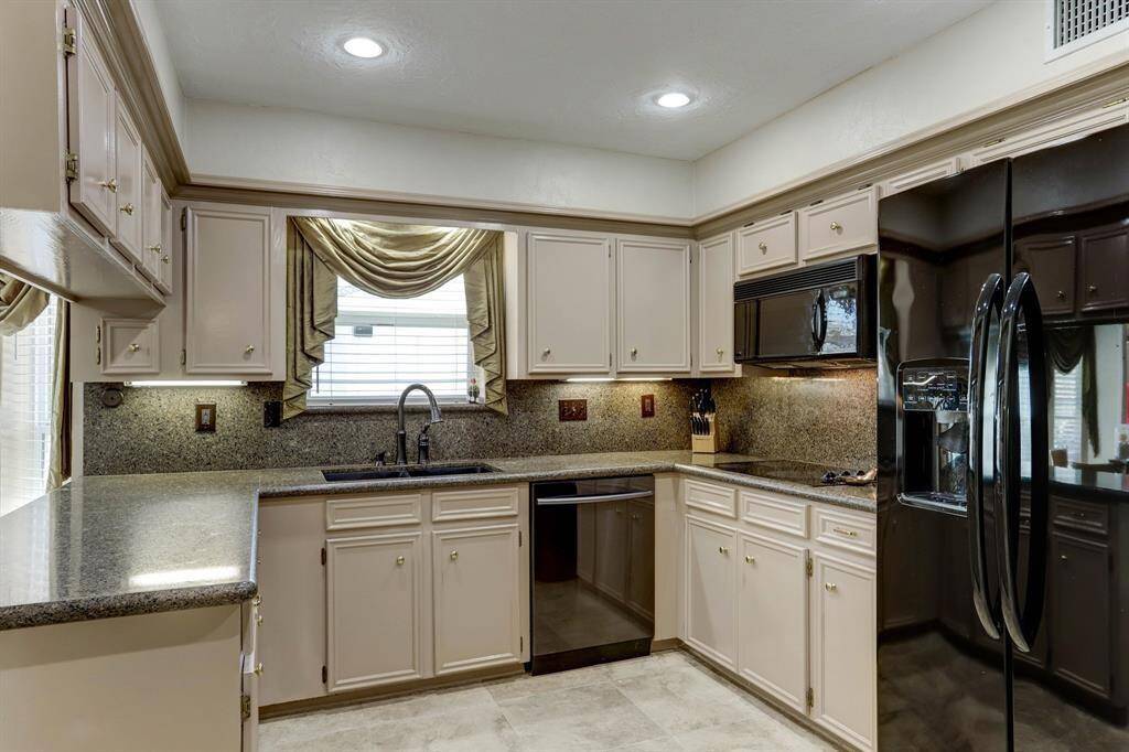 Open Kitchen with granite countertops, double ovens and lots of cabinet space.