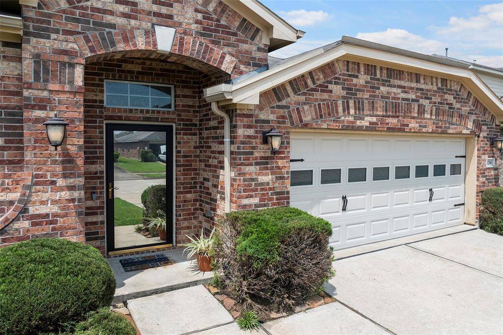 with an inviting entrance and upgraded 2-car garage door