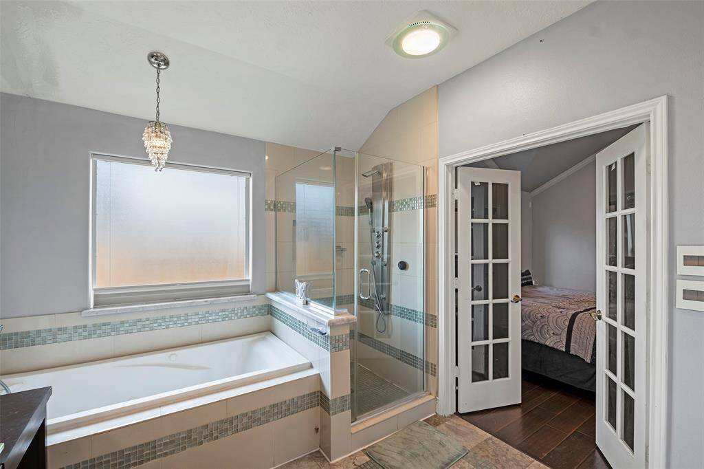 Highlights are the six-foot long, extra deep jetted tub and glassed shower with multiple sprays