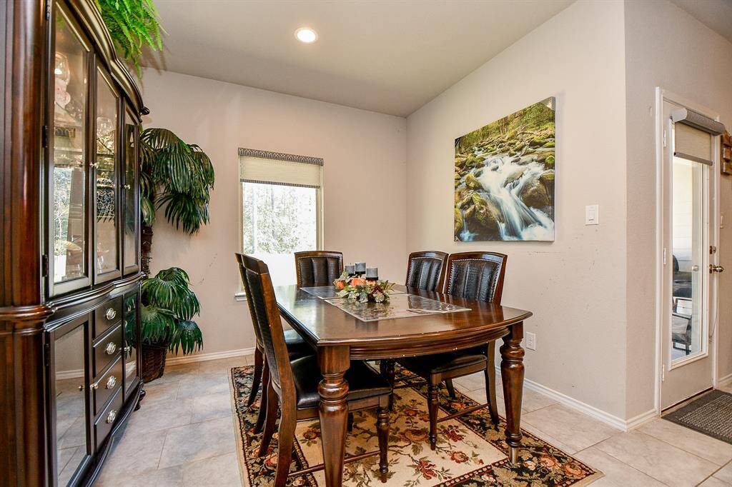 This dining area features large window with a view for all of your gatherings.