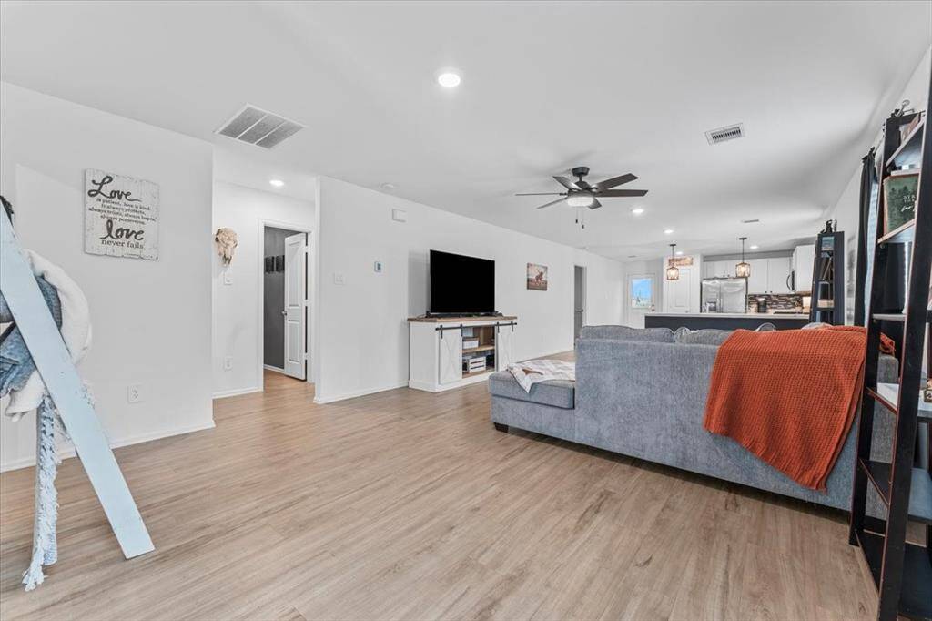 From the entry, the home opens seamlessly into the living room, dining area, and kitchen, creating an open-concept layout that’s perfect for both relaxing and entertaining. The thoughtful design provides a natural flow and inviting atmosphere from the moment you walk in.
