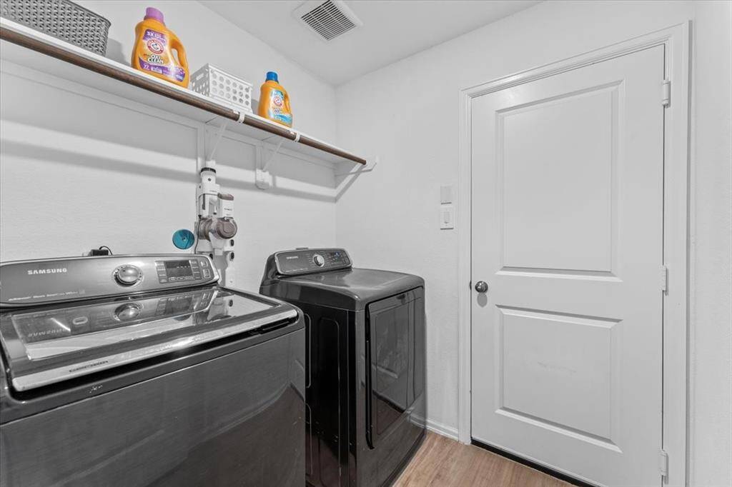 a compact utility room—efficiently designed so it doesn’t take up valuable space in the floor plan.