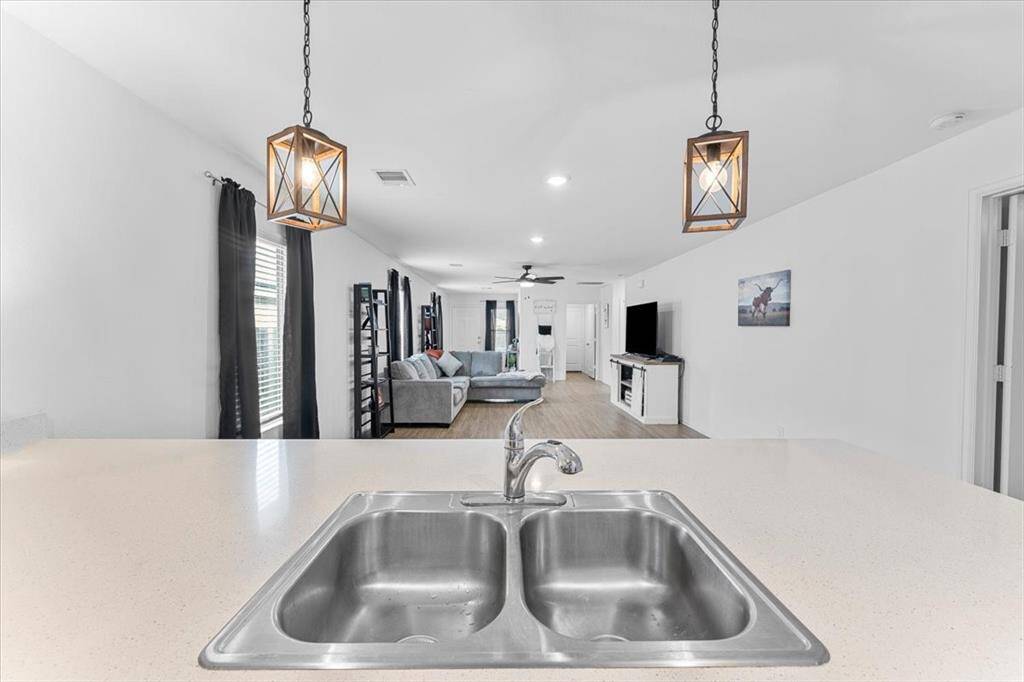 The sink is set in the bar area, which overlooks the dining room—perfect for entertaining or keeping an eye on the conversation while you cook.