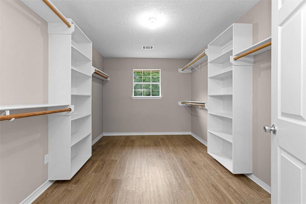Primary walk in closet.