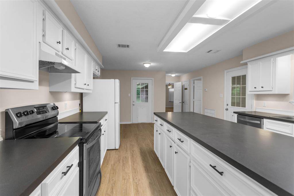 Closer view of the island and appliances.