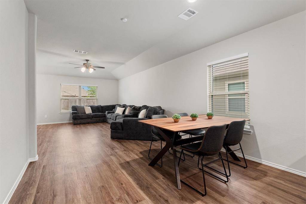 Cozy dining area with large window.