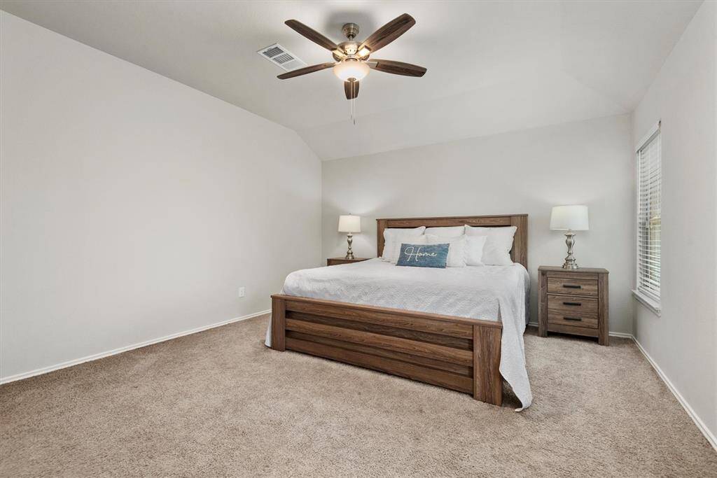 The primary bedroom has soft natural light, a spacious layout, and neutral colors for a calming retreat.
