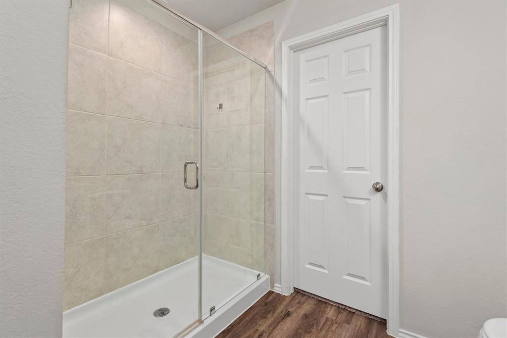 The primary shower is spacious.