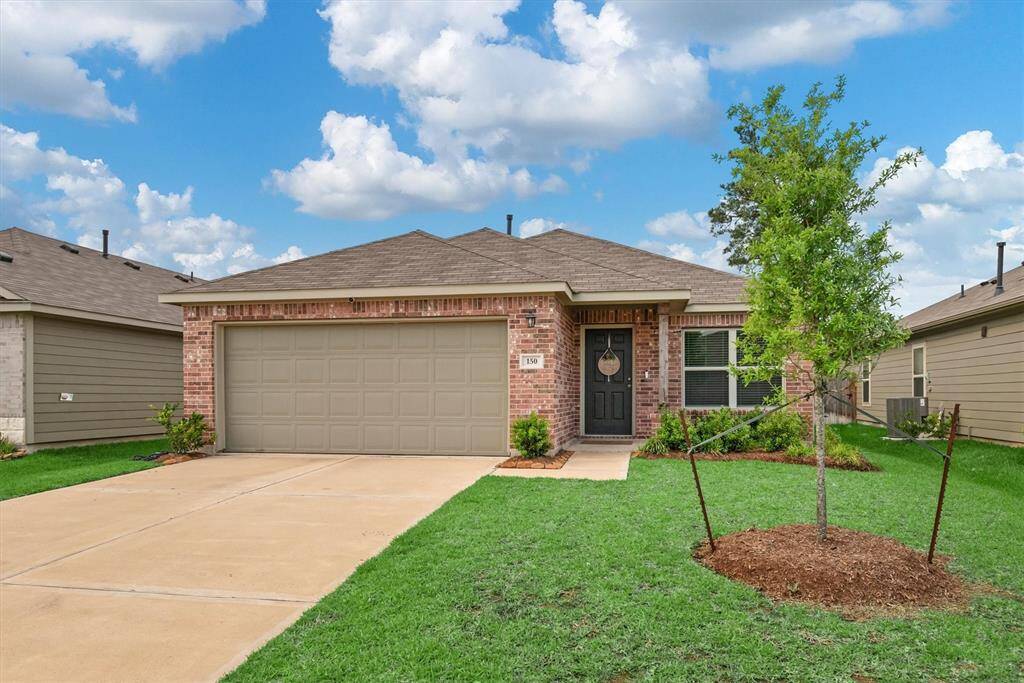 The beautiful front exterior showcases the home's charming curb appeal. The home has a well-maintained lawn and inviting entryway.