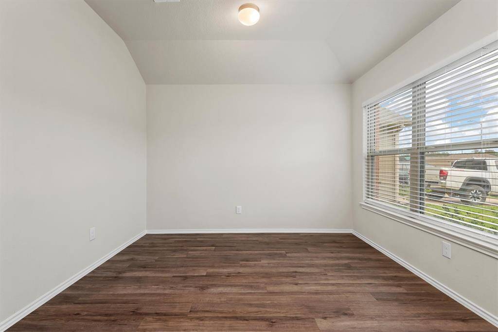The spacious open flex area is filled with natural light. It’s perfectly versatile—ideal for a formal dining room, a stylish home office, a playroom, or even a cozy reading nook.