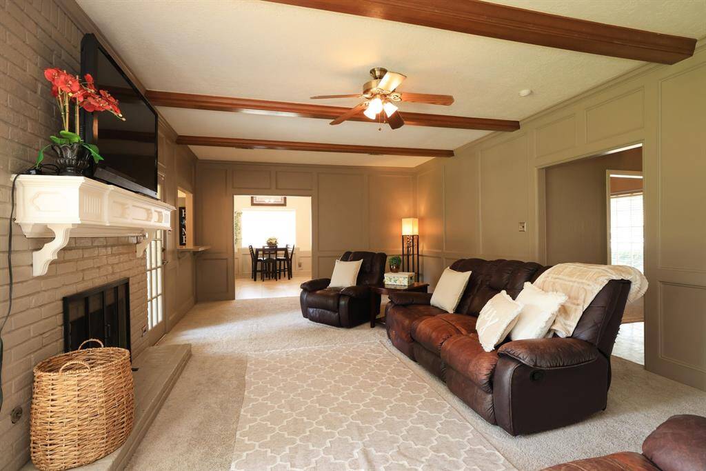 Large living room with view of the kitchen