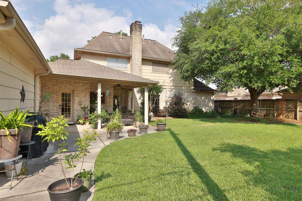Large back yard with mature oak tree