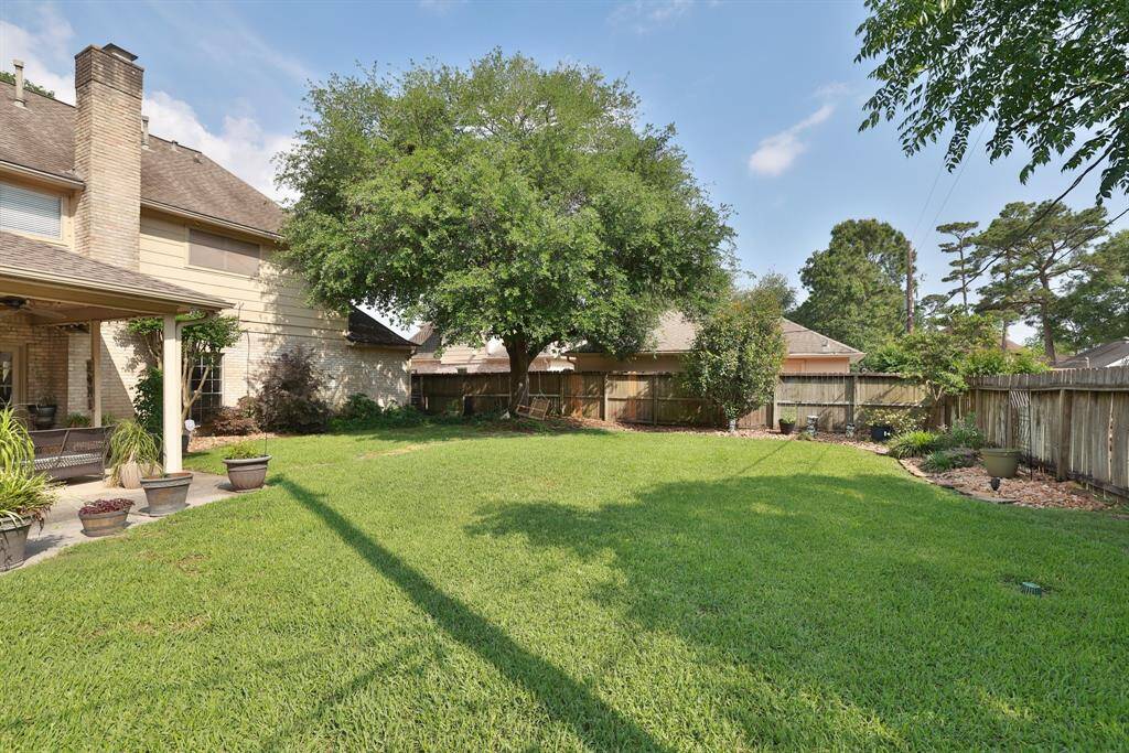 Another view of the fenced back yard