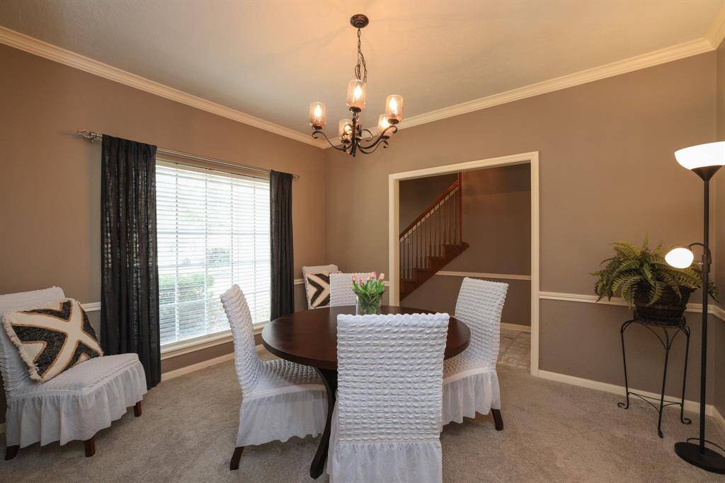 Formal dining room adjacent to kitchen
