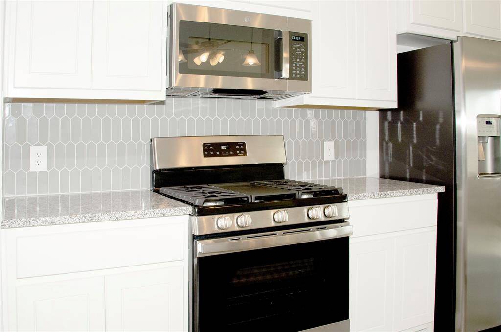 Convenience of All appliances included!  Microwave, Dishwasher, Slide-in Gas/Electric freestanding Range, Refrigerator, Washer and Dryer. Lovely tiled backsplash adds an upgrade to your cooking and entertaining experience.  1730 Cindy Lane.