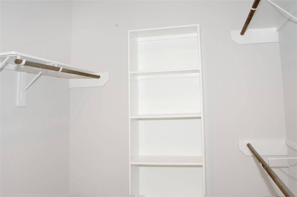 Roomy closet is situated in the ensuite bath with this handy built-in at 1730 Cindy Lane.