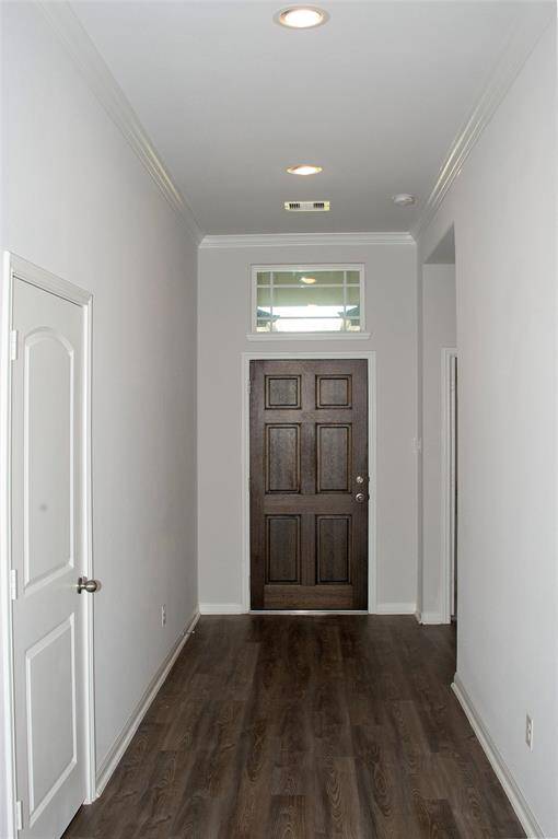 Facing the front door, wide and welcoming entry.  Laundry Room with Garage access at the left of image.  1730 Cindy Lane.  Move In Ready.