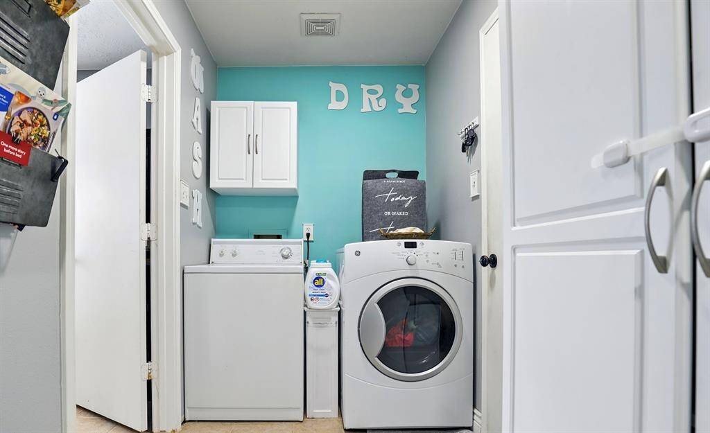 Oversized utility room! Also has a phenomenal built in pantry with cabinet space.
