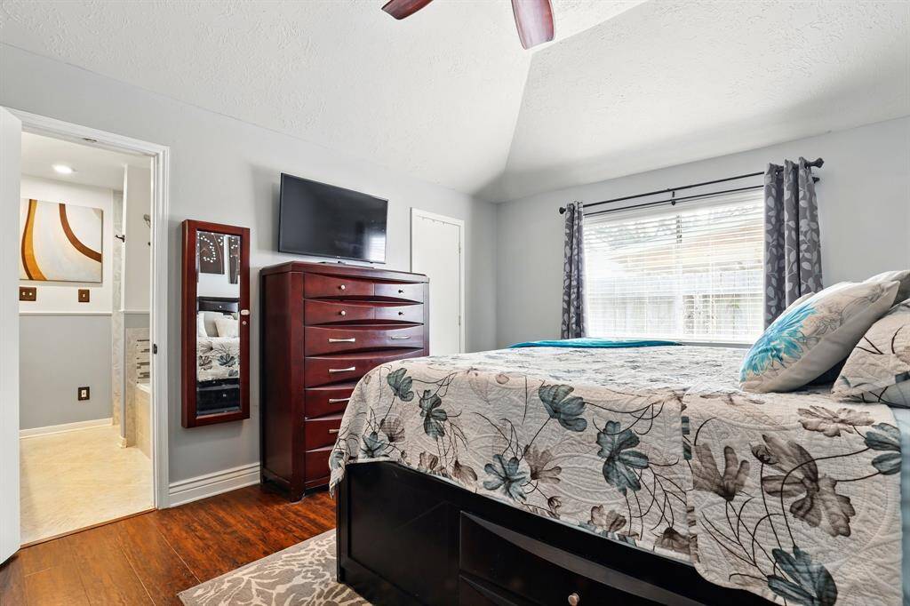 Spacious primary suite offering a peaceful retreat with ample closet space.