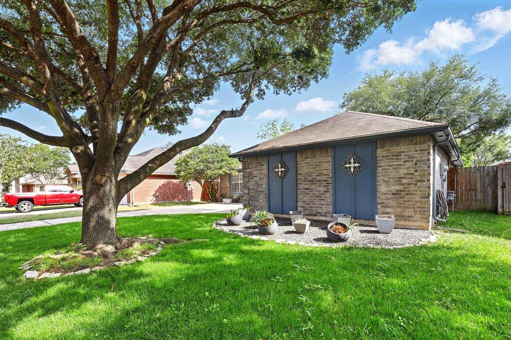 Charming curb appeal with mature landscaping and a welcoming entry.