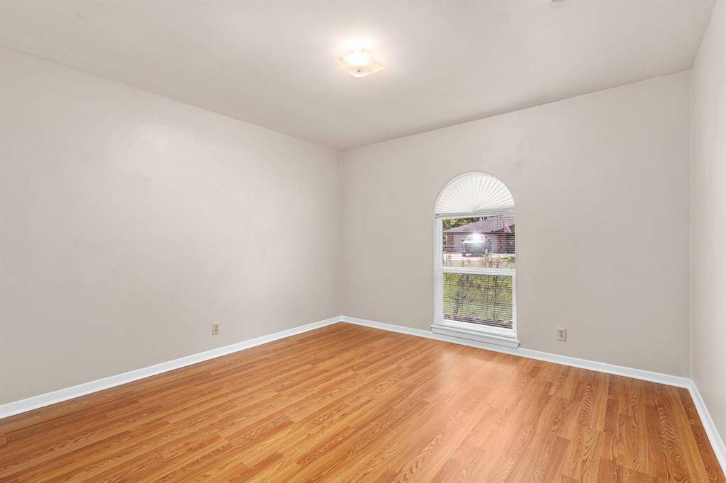 Second of three bedrooms. All bedrooms are generously sized with ample closet space.