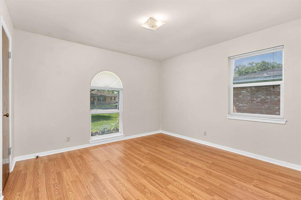 Third bedroom. All bedrooms are generously sized and feature ample closet space.