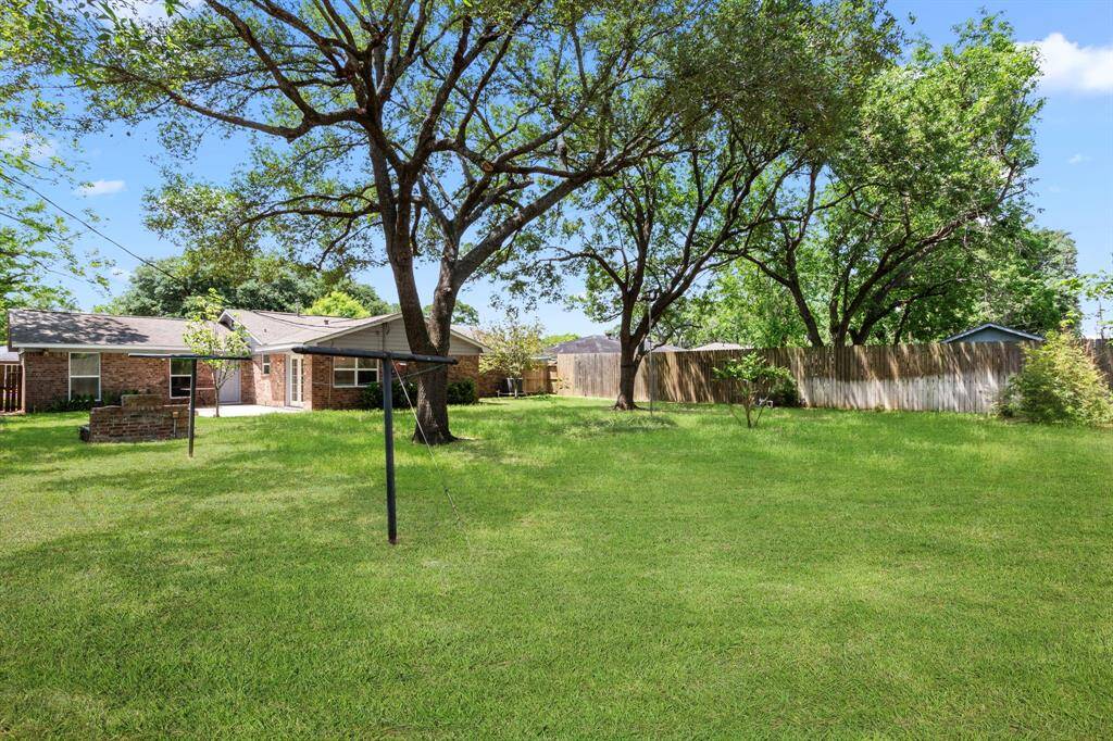 Kids and pets can run and play in the fully privacy fenced back yard, Wonderful memories are waiting to be made enjoying this fabulous outdoor space. Grass color has been enhanced.