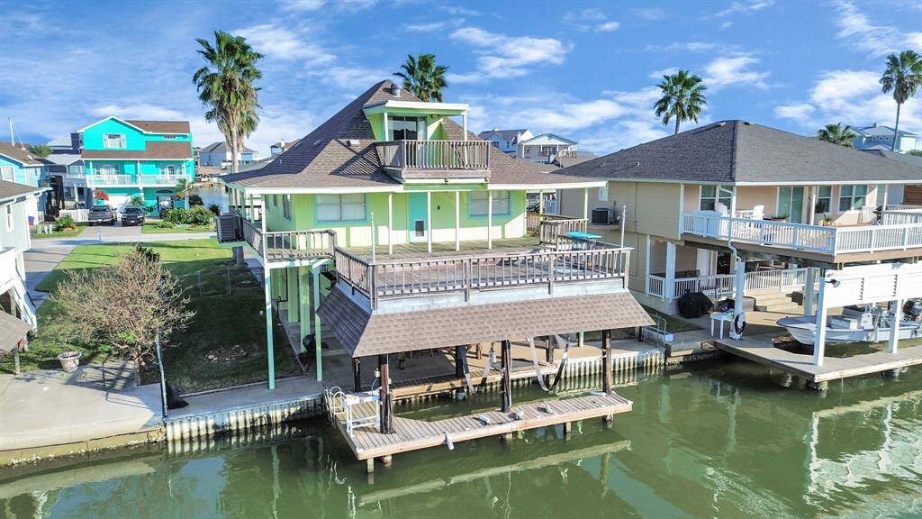 Experience the ultimate Tiki Island lifestyle with expansive multi-level decks offering stunning waterfront views.