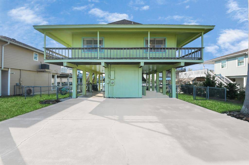 Generous driveway with a convenient carport.