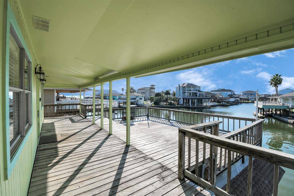 Spacious waterfront deck with stunning canal views, perfect for relaxation and entertaining.