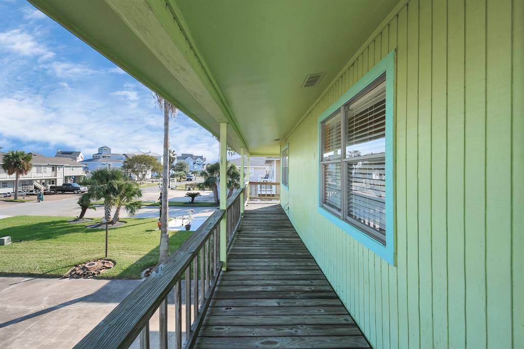 Expansive wraparound deck offers stunning views and ample outdoor living space.