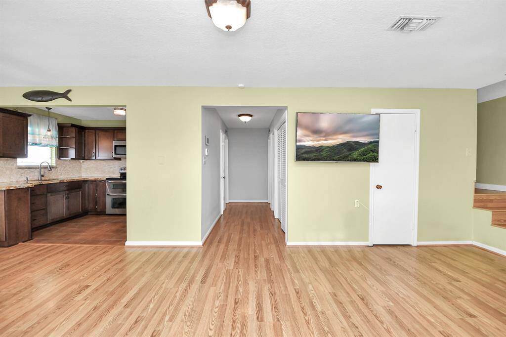 Inviting entryway leading to spacious dining and living areas.