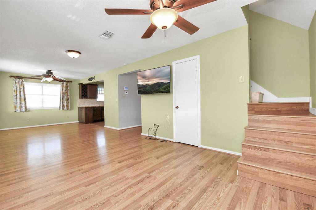 Upstairs features a bedroom and full bath for added convenience.