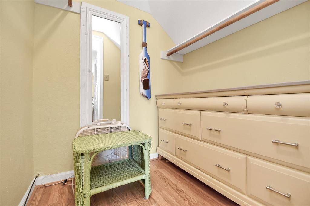 Spacious second-floor bedroom closet featuring ample storage with built-in drawers and hanging space.