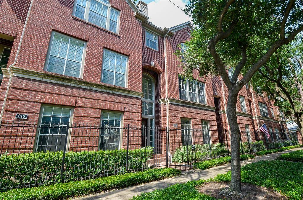 This stately looking brick exterior, on a lush tree lined street, is home to a beautiful Midtown townhouse at 208 Bremond Street, Houston, TX.