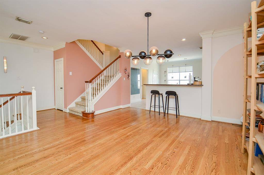 What a satisfying view from living area, to kitchen, and the continued stairway to the 3rd level.
