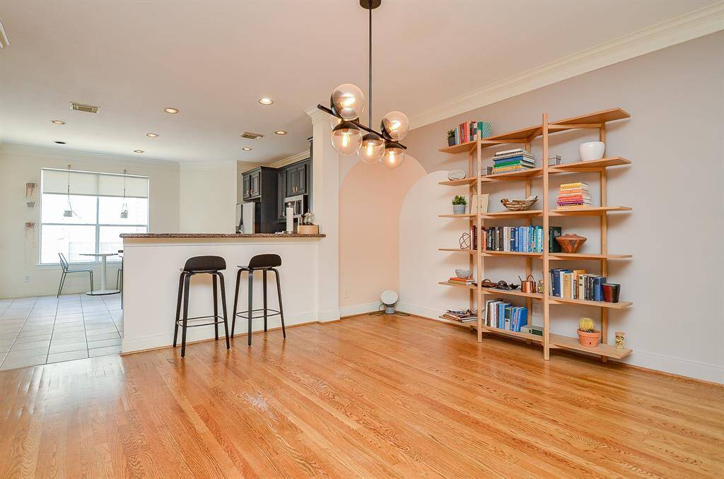 Big windows bring more sunshine into the kitchen in the perfect spot for a breakfast nook, if desired; with another great view of the generous dimensions of wall space in the dining area.