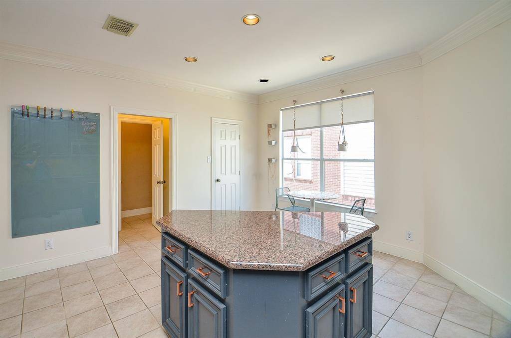 A hallway/half-bath ? is easily accessed beyond the open doorway, up center.