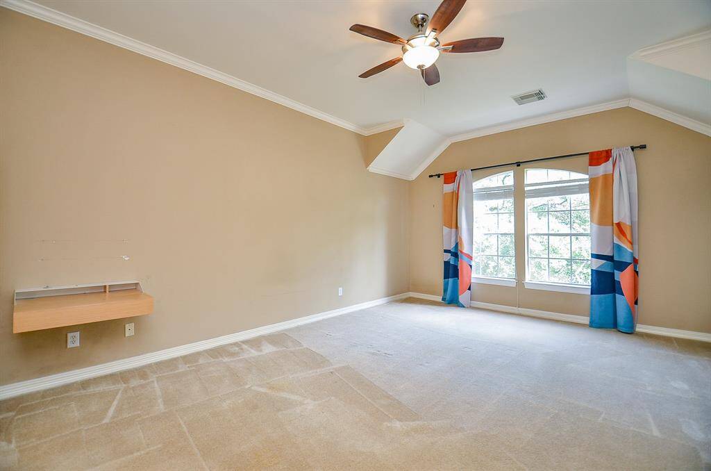 Can you picture your favorite bedroom pieces in this magnificent carpeted primary suite?