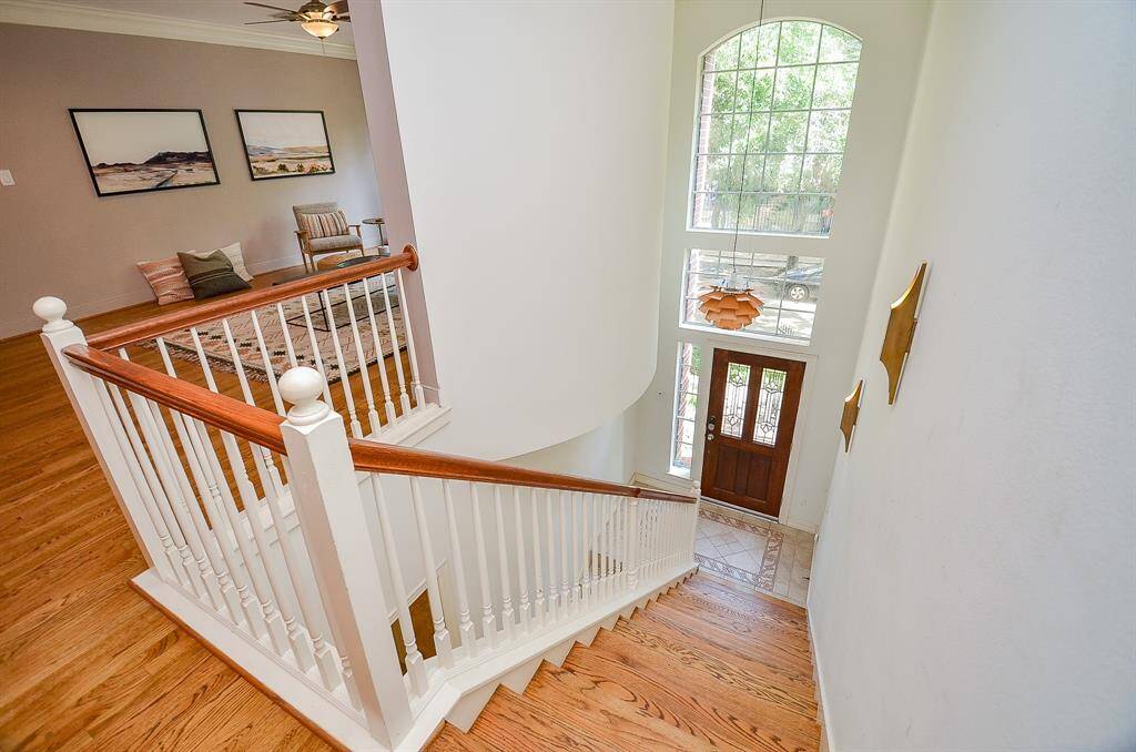 Wide open airy space fills the stairway's path to your 2nd floor living area, left.