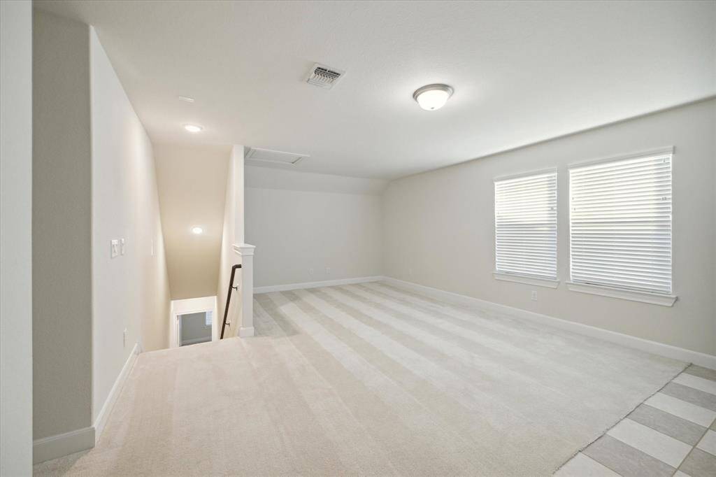 Game room without furniture is a blank slate. This room could be used a flex space to create your hobby room, exercise or tv room.