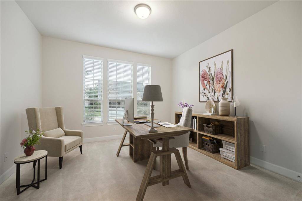 Front bedroom staged as an office. This large room could be used as an office, exercise room or a bedroom. Bathroom located just outside of the bedroom in the hallway.