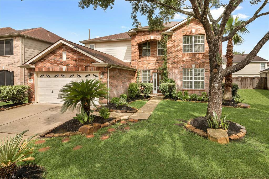 Enjoy the comfort of a spacious patio complete with refreshing ceiling fans, perfect for relaxing on warm days.