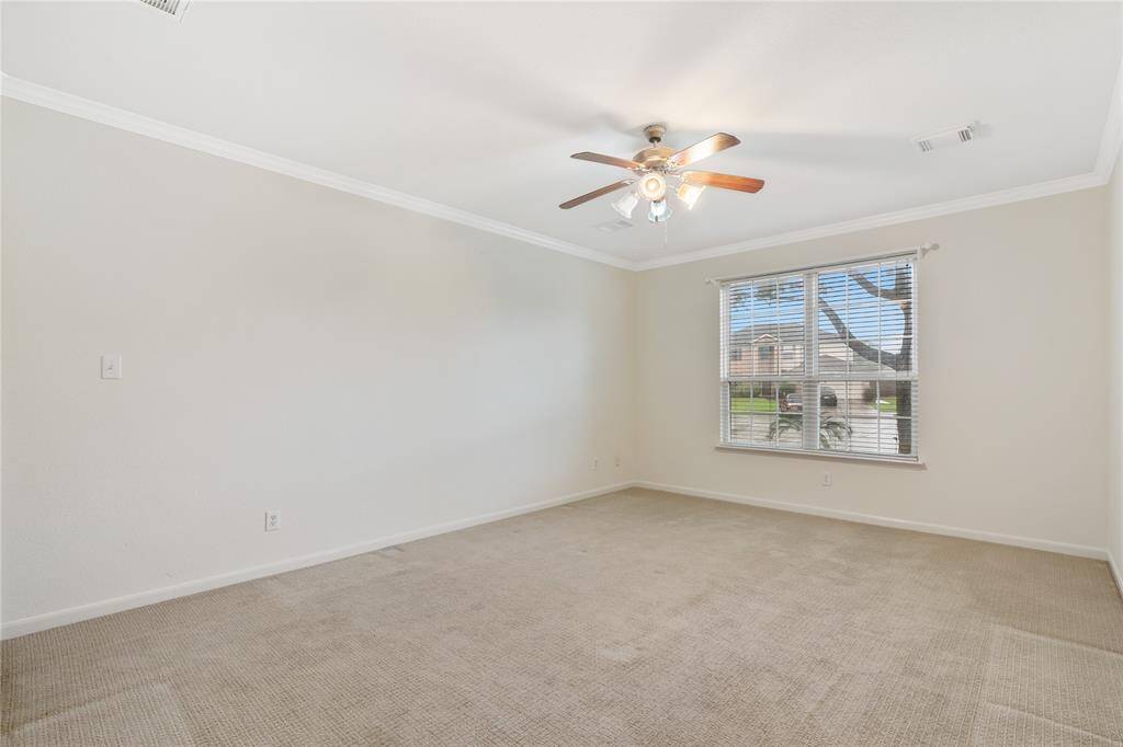 Sspacious 1st floor master suite with ample natural light.